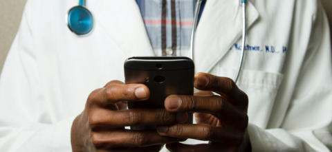 Image of physician holding a smart phone