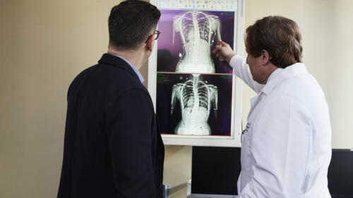 Image of man talking with physician about xray